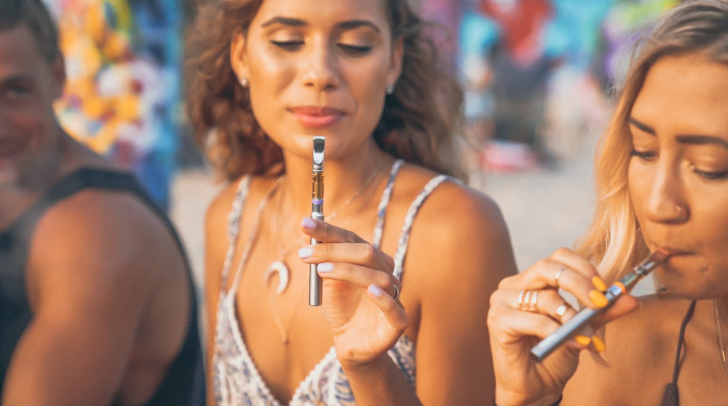 Two Ladies Vaping Happy Sticks